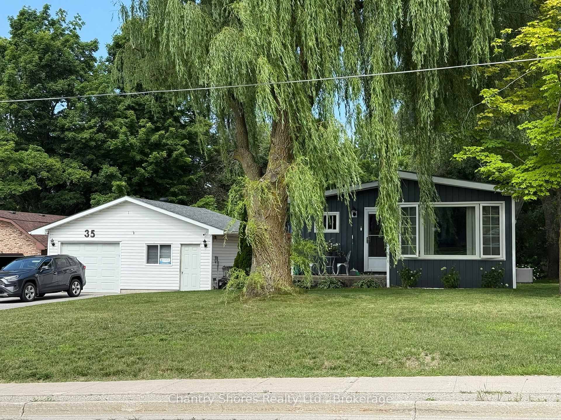 Are you looking for an updated, one level bungalow with many modern features and the added bonus of a separate garage, workshop, and storage in the charming village of Tiverton ...