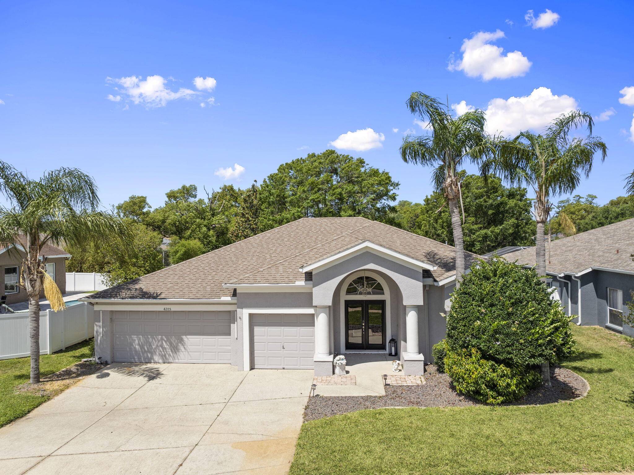 Welcome to this spacious and beautifully maintained 4 bedroom, 3 bathroom pool home with a 3 cars garage and private access to the serene Bell Lake.