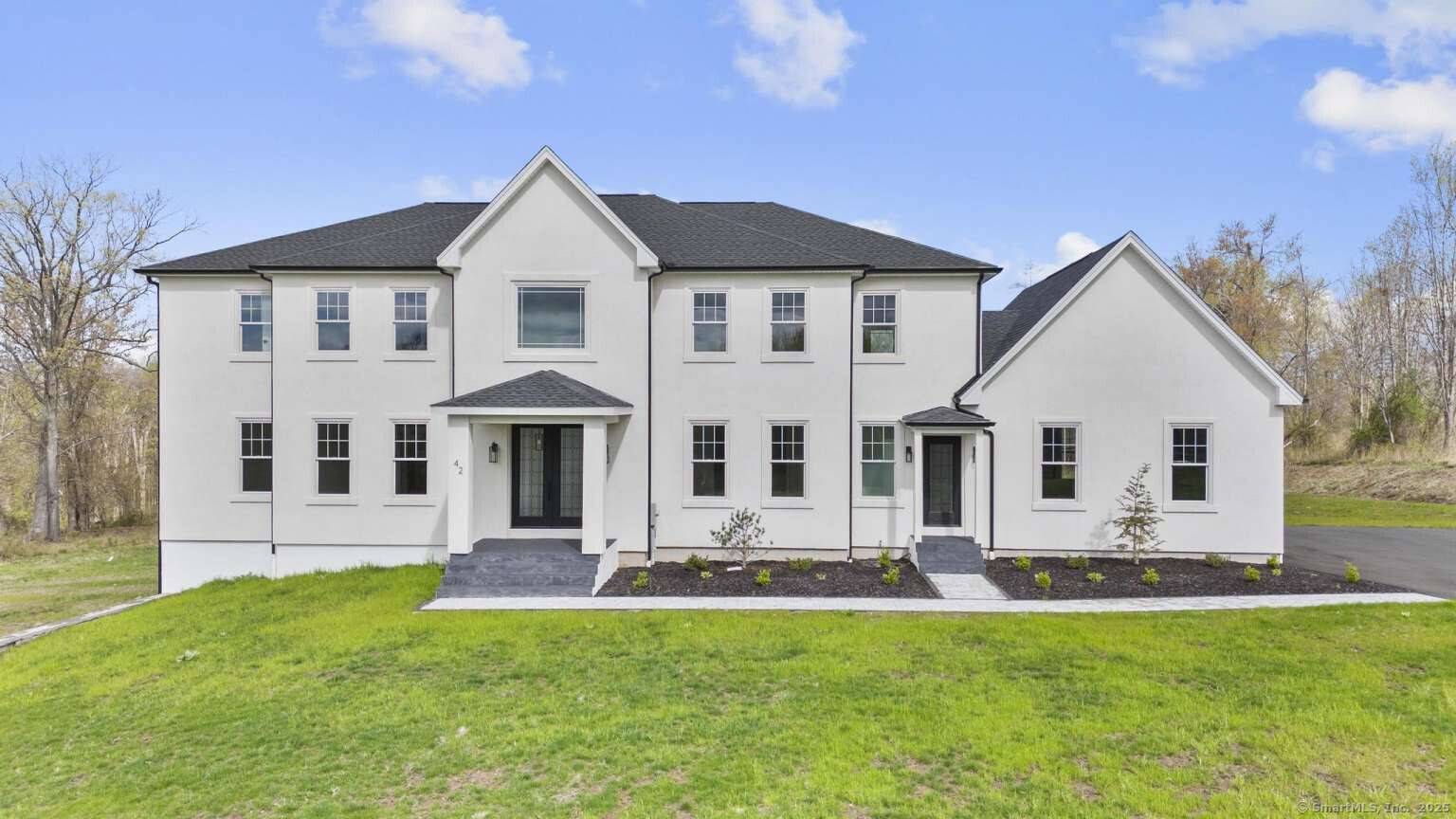 Welcome to 42 Pine ledge trail exceptional new construction This stunning colonial home, featuring stucco exteriors, offers four bedrooms and three full bathrooms, along with two half baths, all set ...