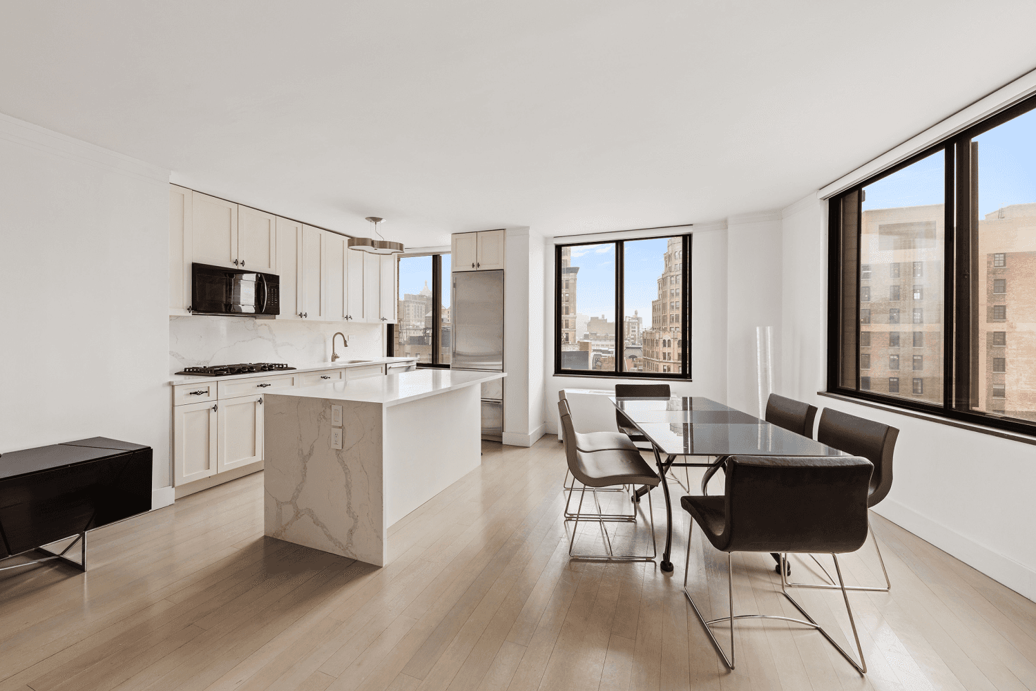 Exquisite corner 2 bedroom, 2 bathroom home with split wing layout and 6x9 balcony, saturated with natural light through oversized windows facing south and west that capture city skyline views.