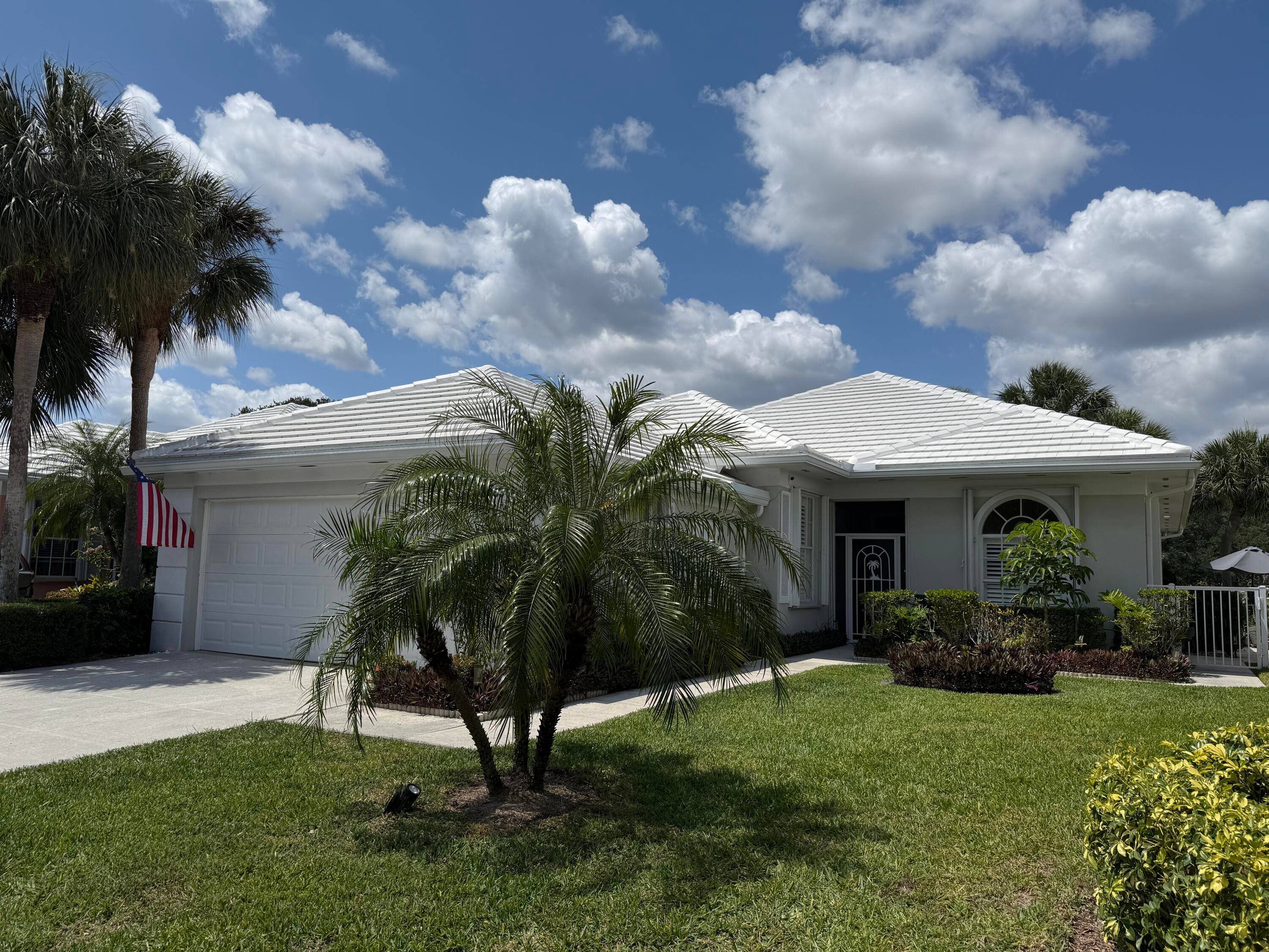Embrace the Florida lifestyle in the beautifully maintained DiVosta Built home with serene lake views and a sun filled Florida room, perfect for morning coffee or sunset gatherings.