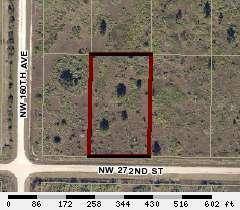 This lot is adjacent to a corner lot and is not far off the paved road.