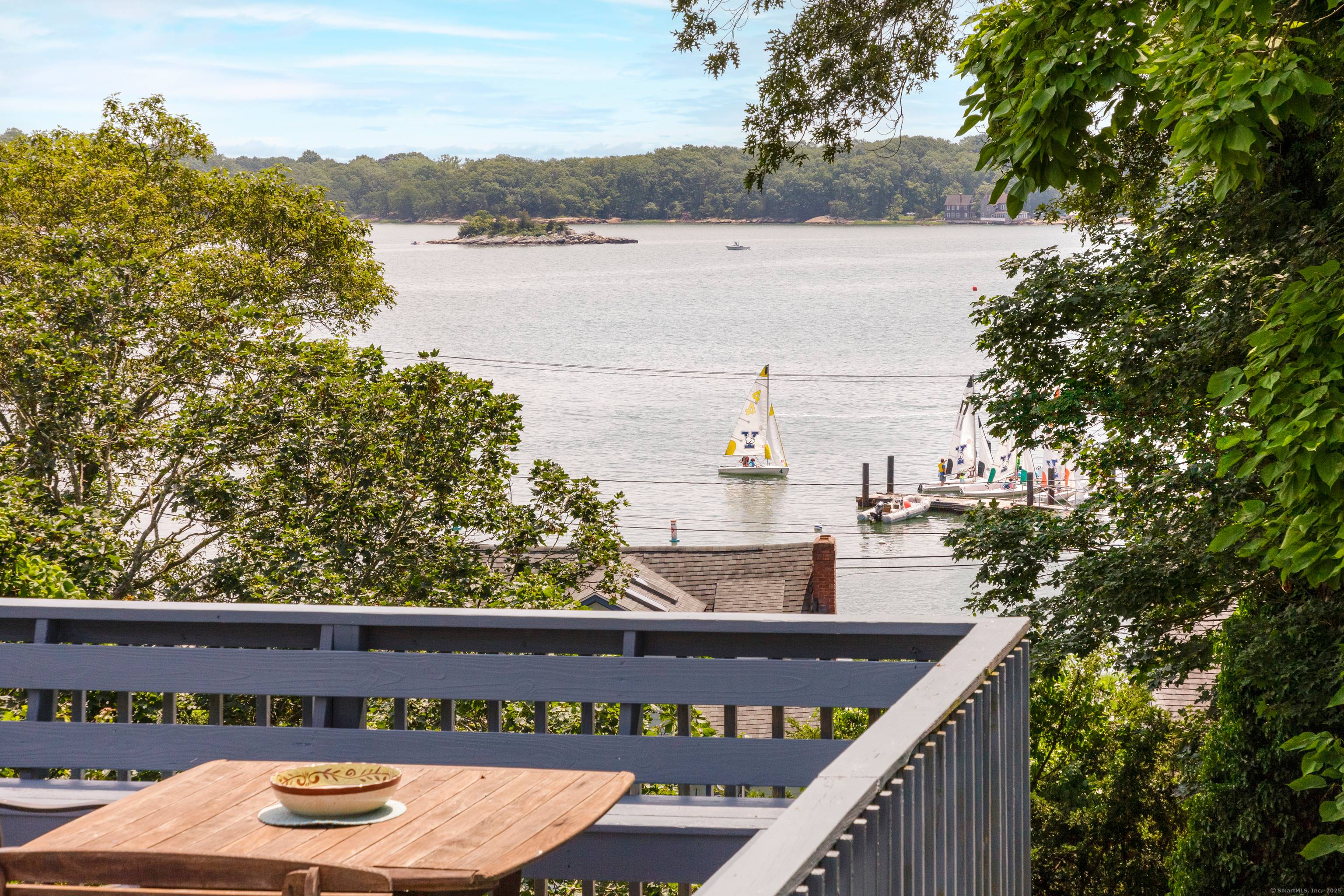 Perched on a peninsula overlooking Short Beach and Granite Bay, this legal two family residence offers sweeping, unobstructed views of Long Island Sound and the Yale Corinthian Yacht Club.