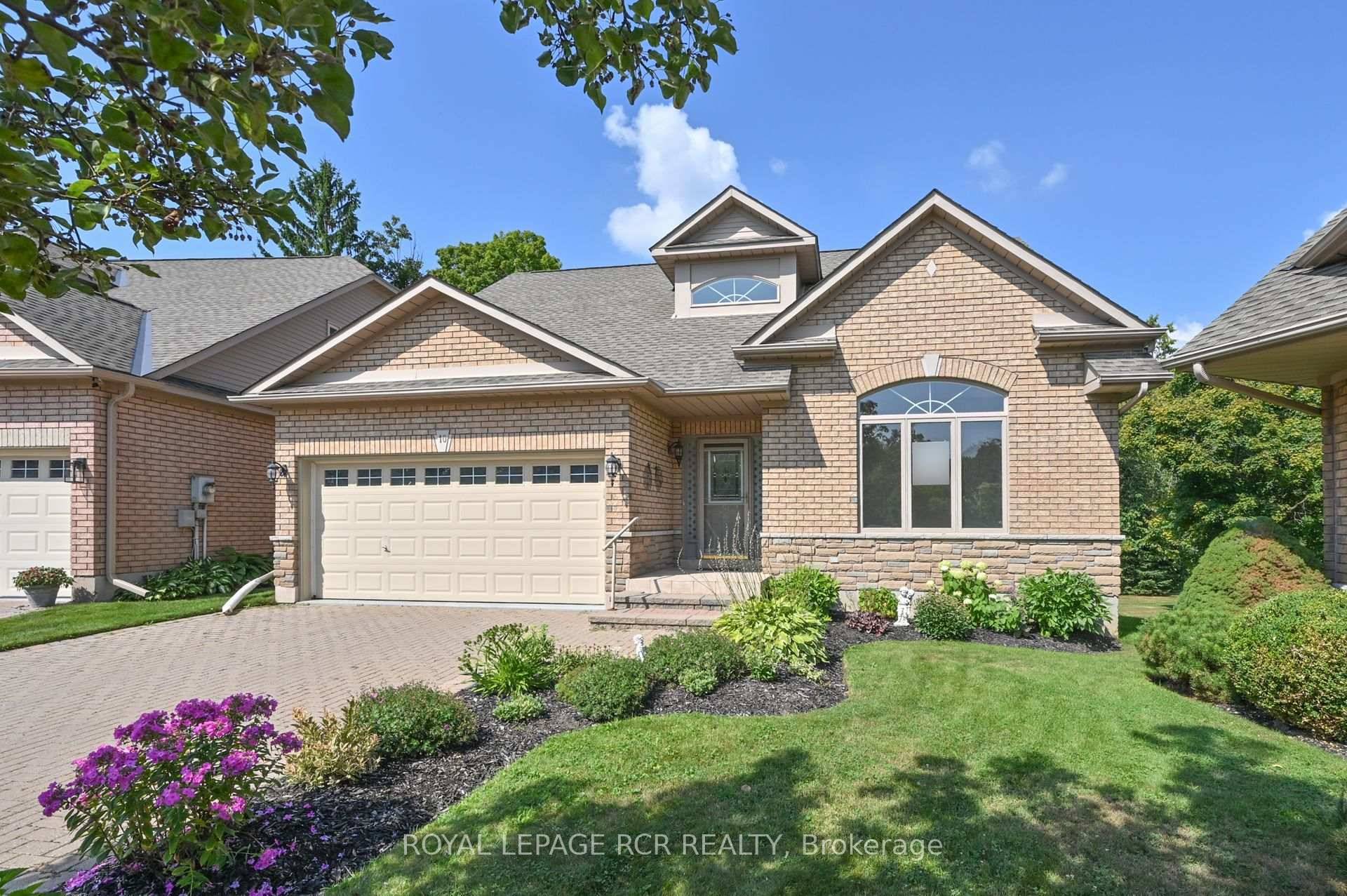 Welcome home to 10 Forest Link a spacious bungaloft backing onto a beautiful golf course location in Briar Hill.