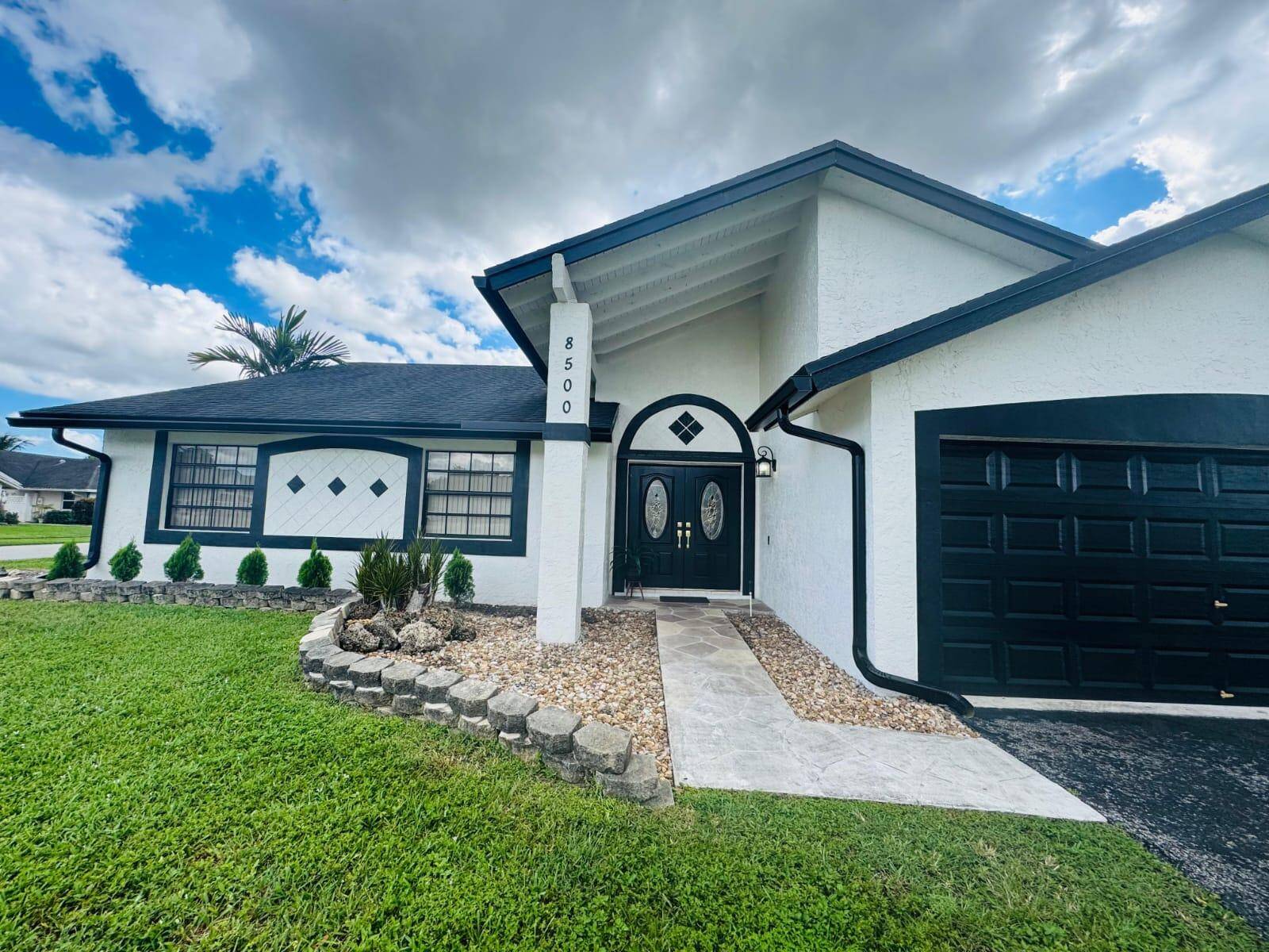 Welcome to 8500 NW 52nd Ct a spacious 3 bedroom, 2 bath home offering 1, 876 sq.