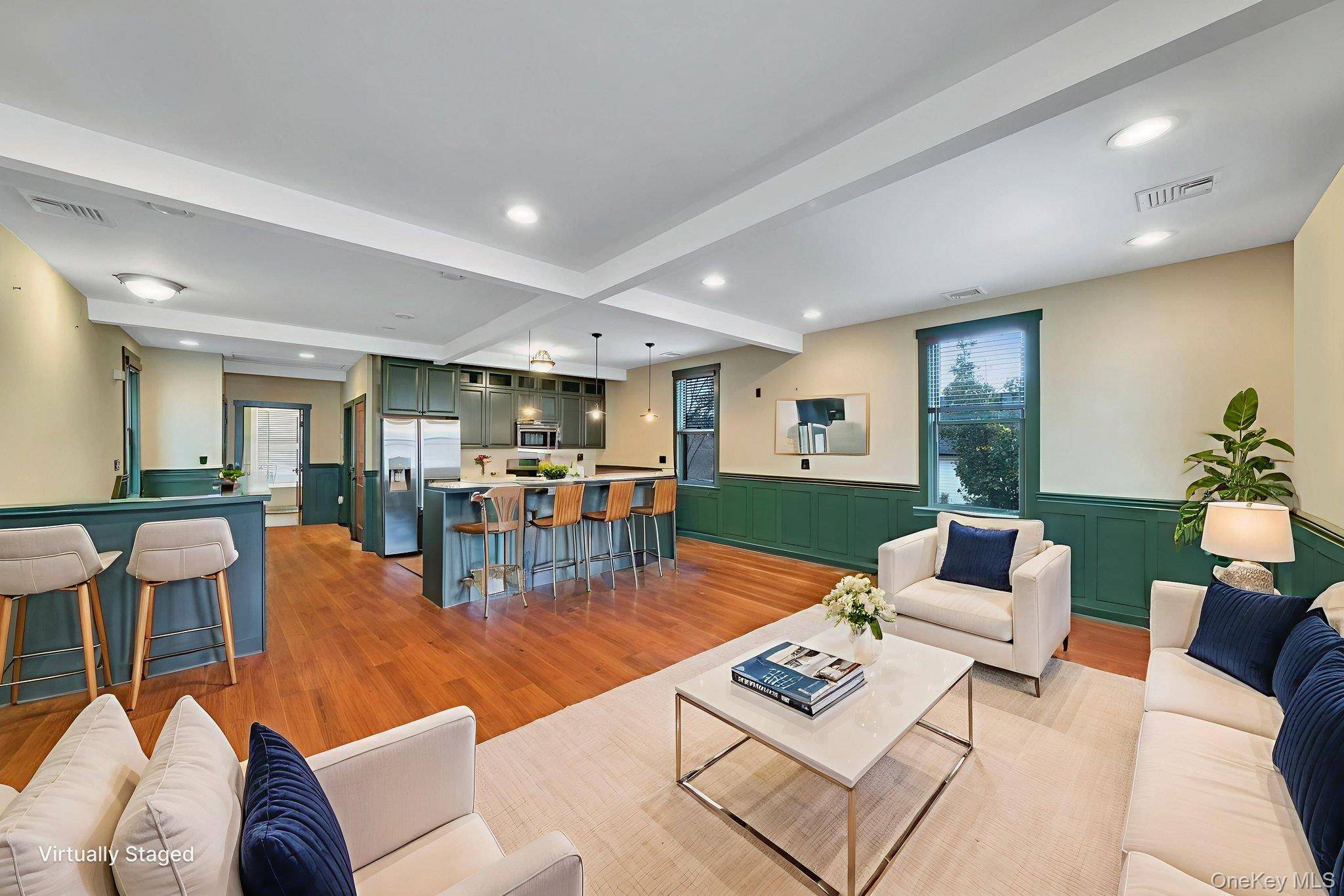 This meticulously renovated second floor one bedroom offers close to 900 sq ft of beautifully designed living space with soaring ceilings and a bright, open layout.