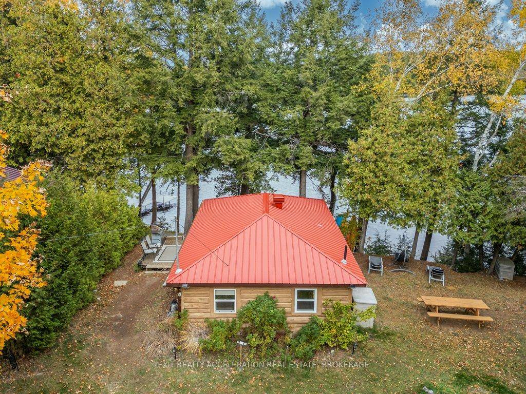 Escape to the tranquility of lakeside living with this charming two bedroom log cottage nestled on the peaceful shores of Sharbot Lake.