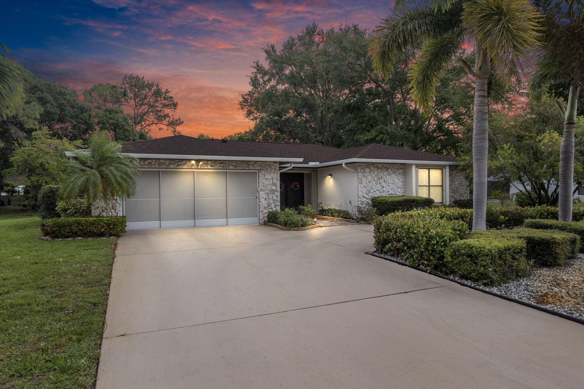 Tucked away on a private road surrounded by estate style homes, this rare half acre pool home offers the perfect blend of space, privacy, and beauty.