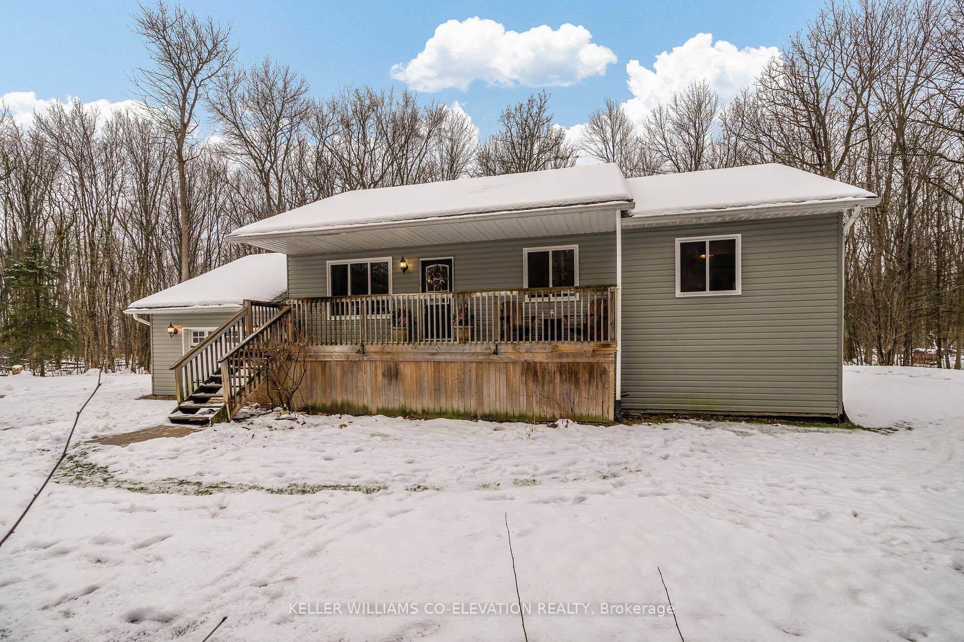 Nestled On A Private 1. 28 Acre Lot, This Charming Raised Bungalow Welcomes You, With Its Covered Front Porch, Instantly Setting The Tone For This Cozy Retreat.