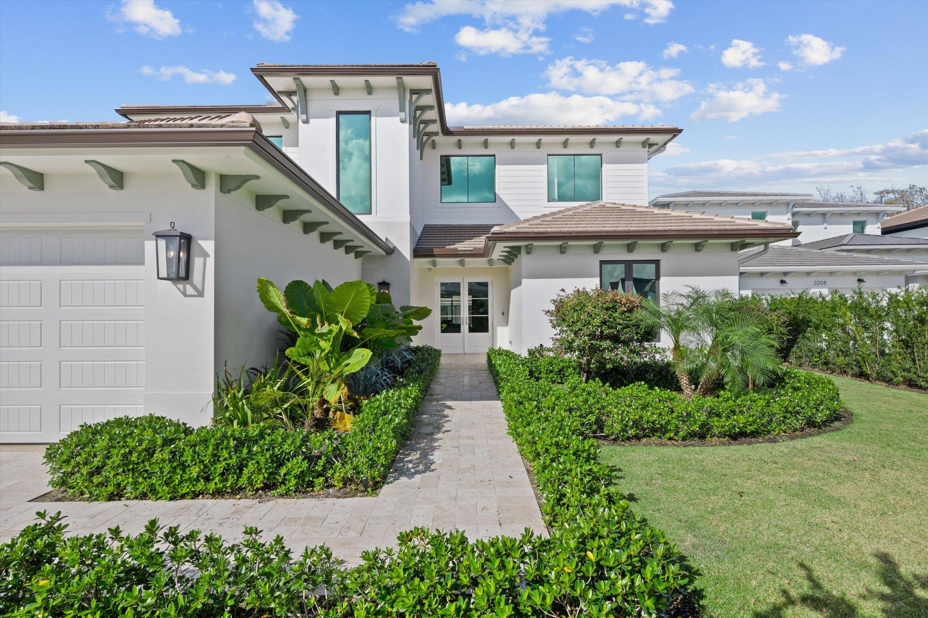 This new construction home is located in the coveted neighborhood of Blue Cypress within the private gates of Palm Beach Polo.