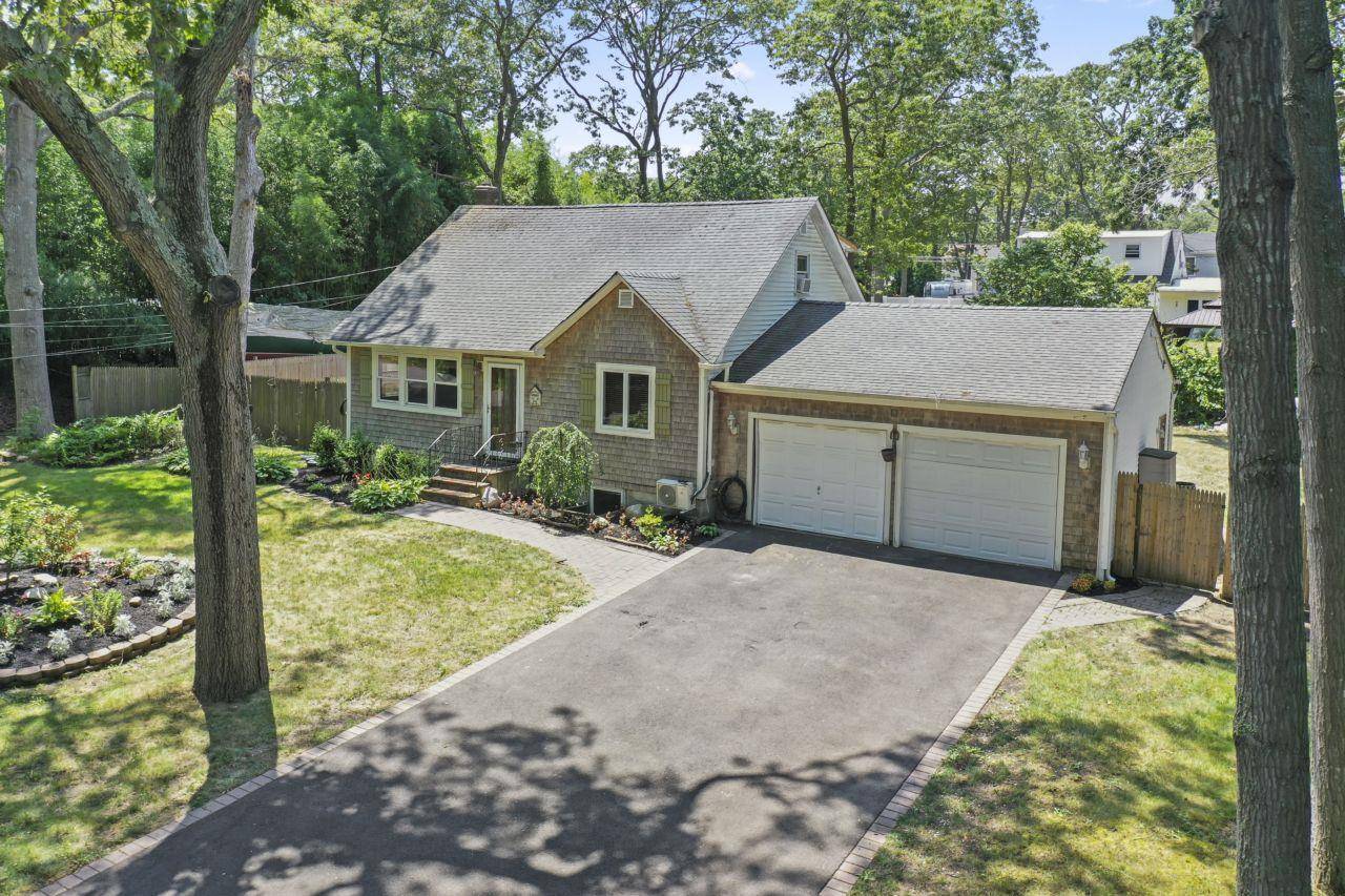 Welcome to this charming Cape Cod home in the vibrant community of Mastic, NY !