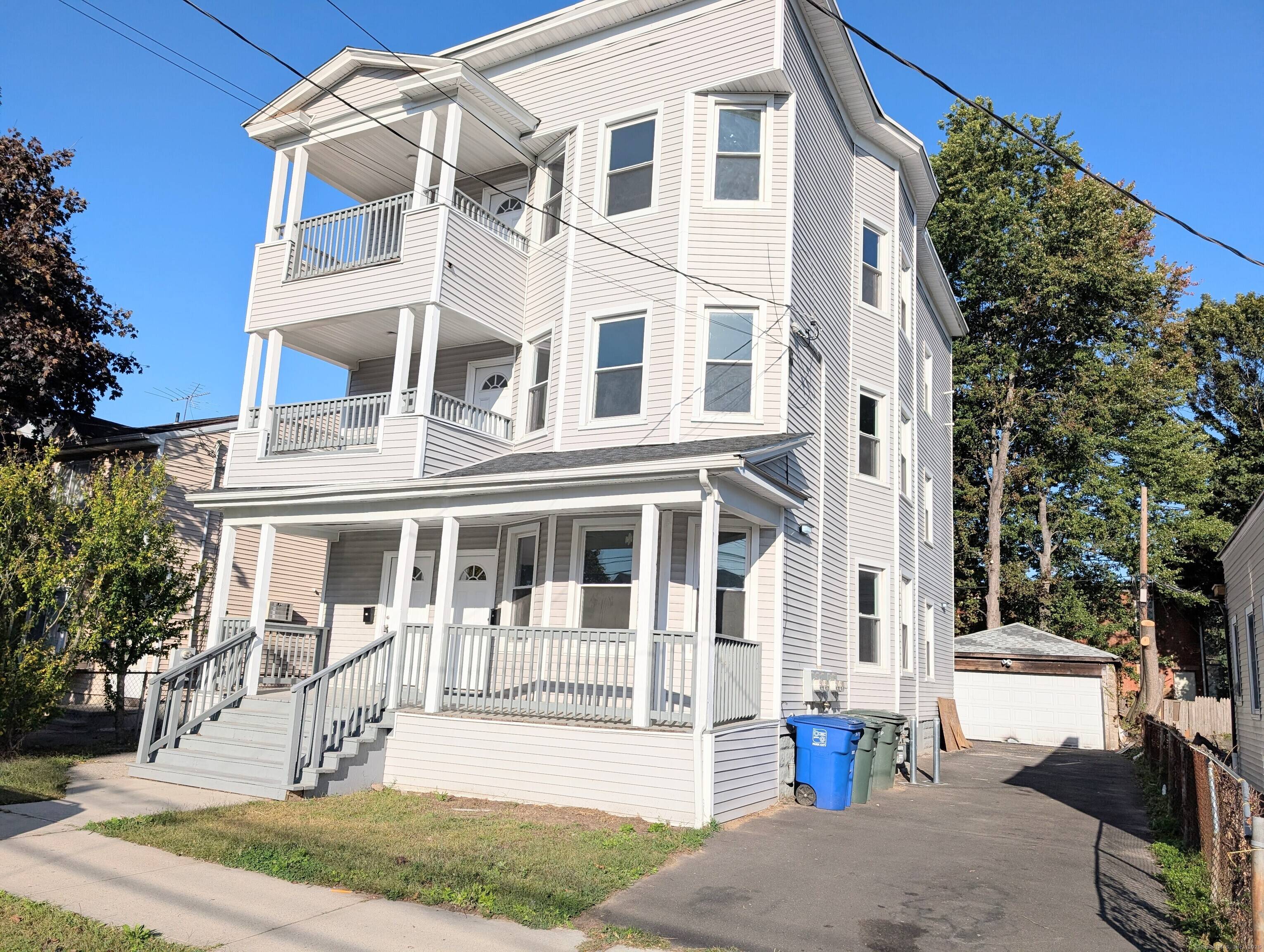 Completely renovated 3 family home with a 2 car detached garage has been rebuilt from the studs up with luxury finishes and modern design delivering the look, feel, and quality ...