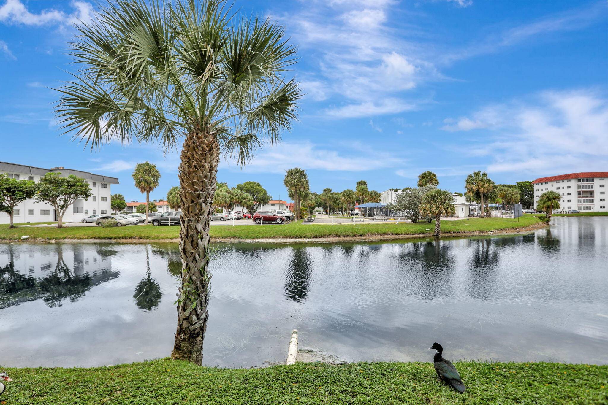 Step into elegance with this beautifully furnished, first floor unit featuring breathtaking waterfront views and lush landscaping.