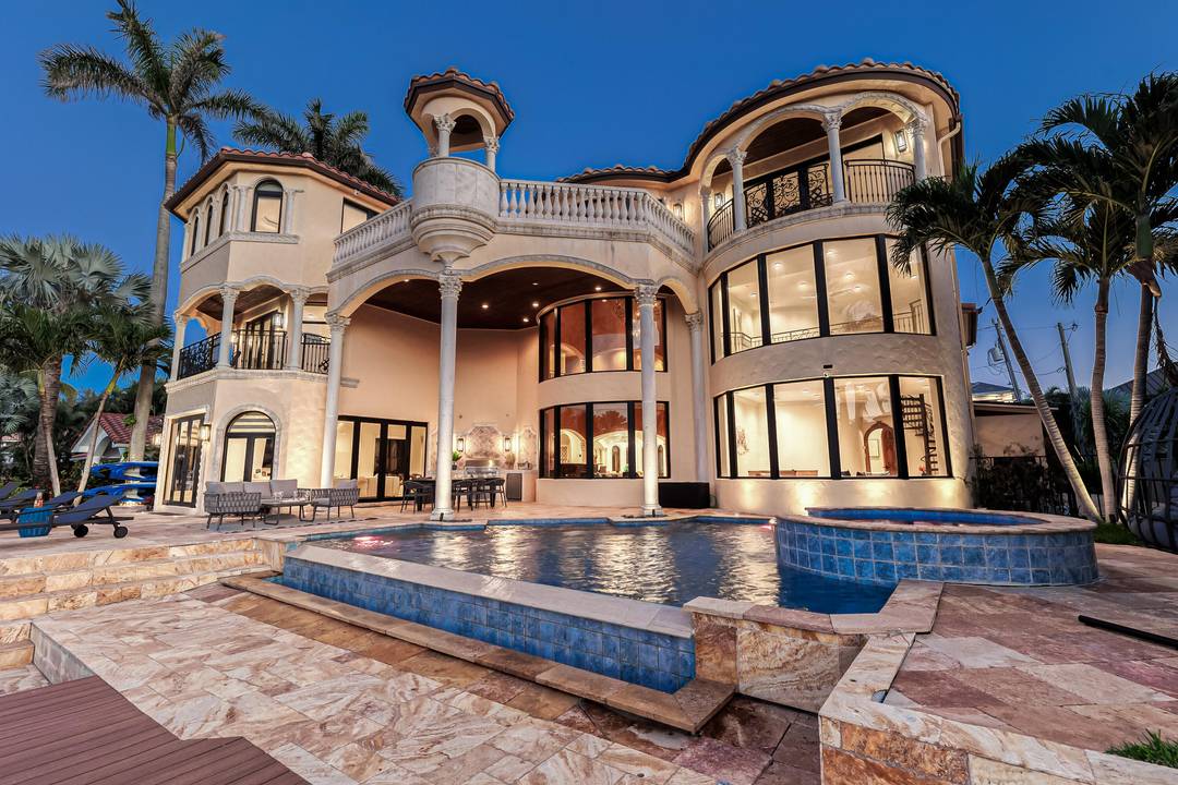 Embrace luxury living at its peak in this magnificent Delray Beach Shores waterfront estate with beach access.