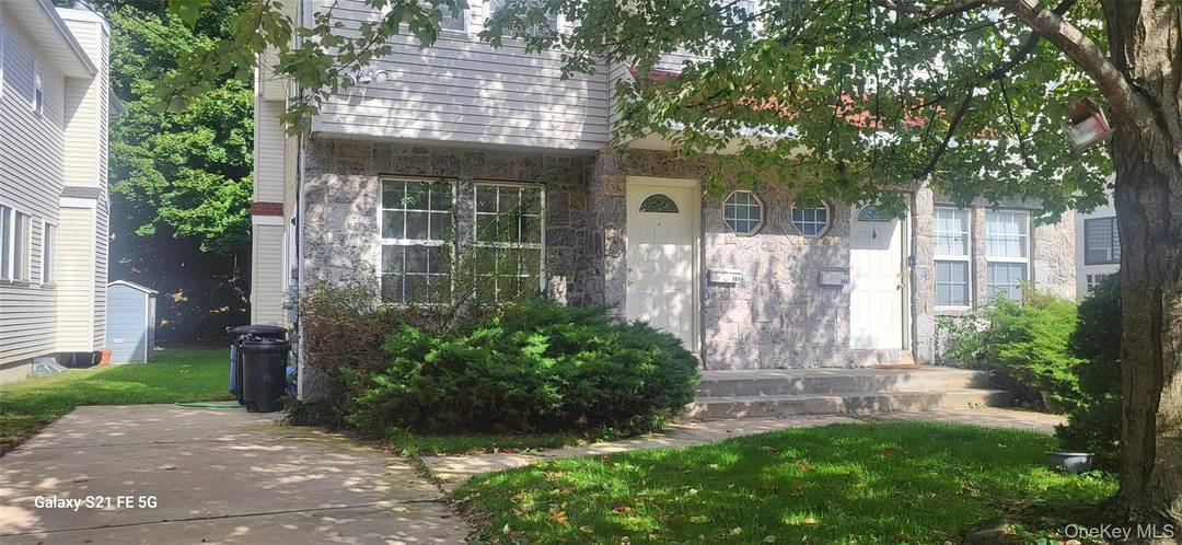 Luxury Triplex, Livingroom dinning room combo including fireplace.