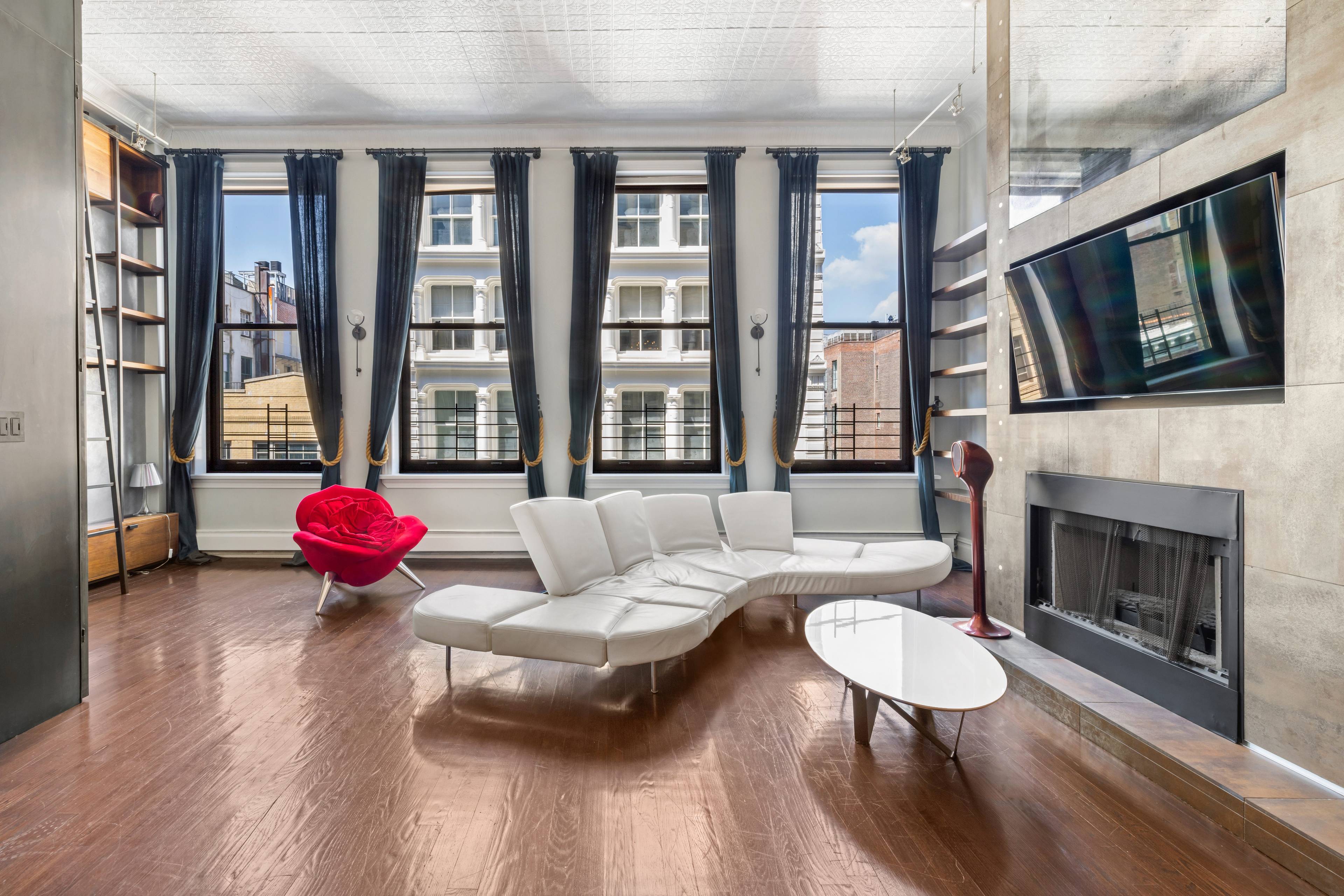 A Furnished Radiant SoHo Loft with Abundant Natural Light and 13 Foot Ceilings.