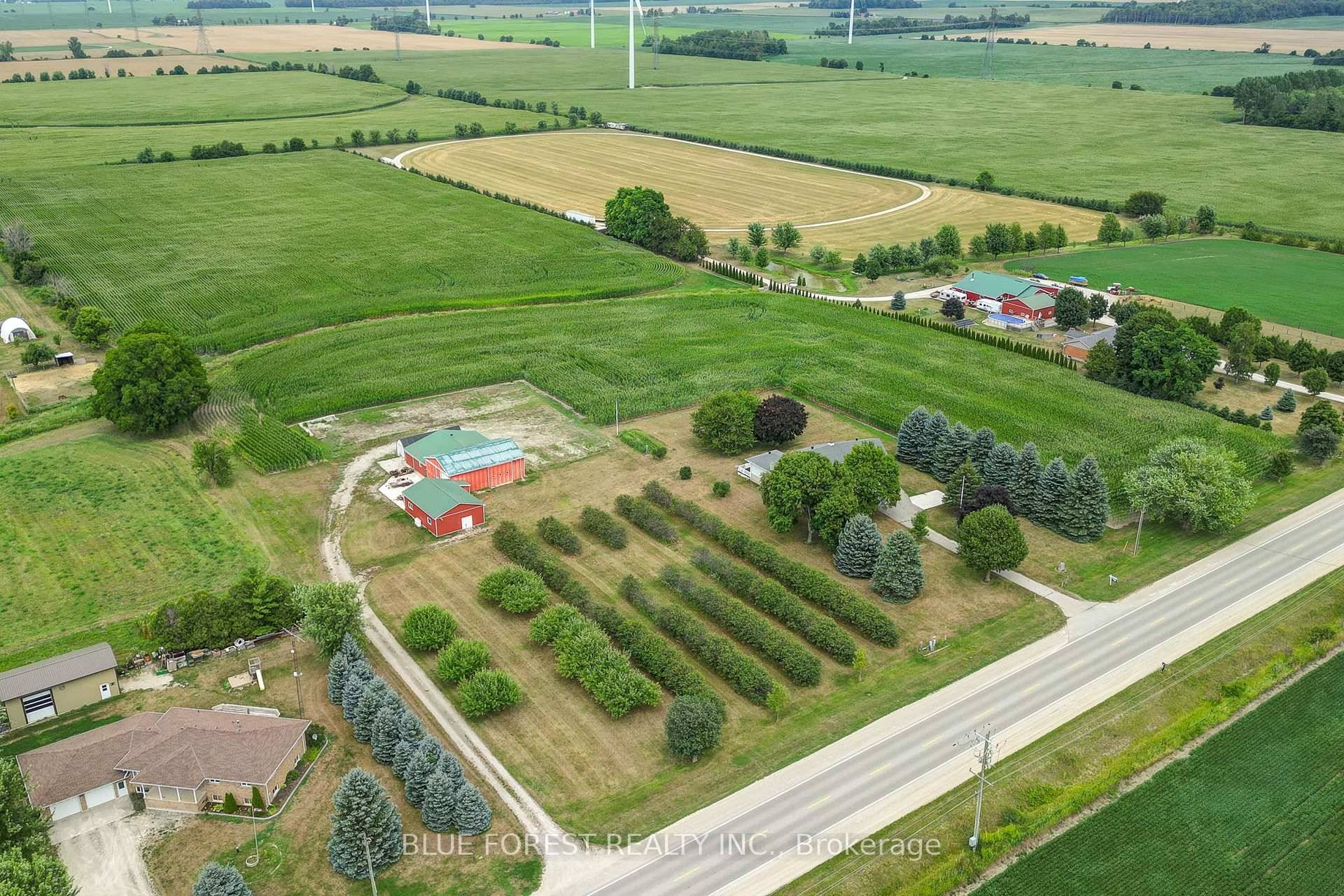 Situated on 21. 5 acres, this property features a large shop with bay door, car hoist, and loft, plus a second building with a 3 piece bath, perfect for hobbies, ...
