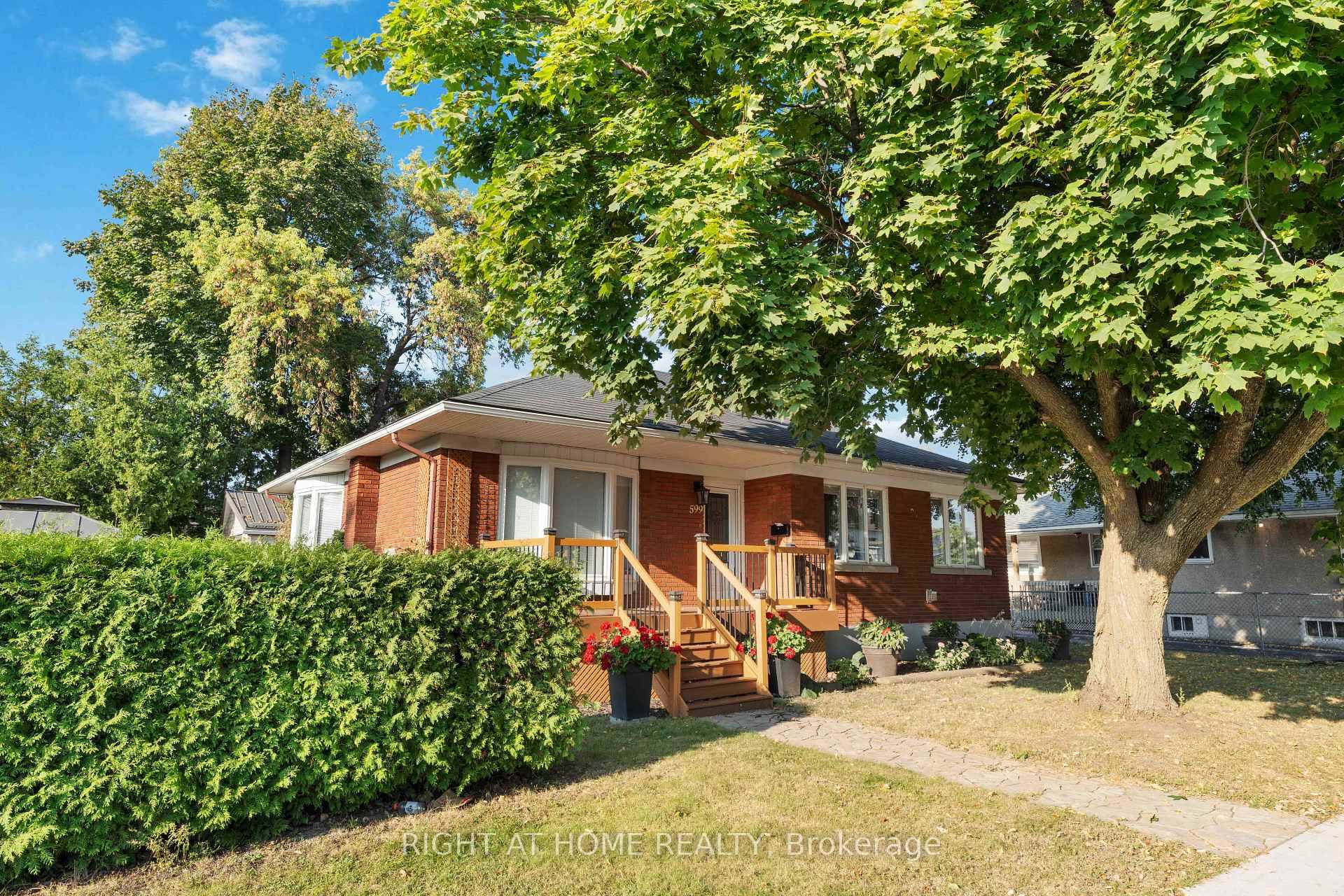Great Location ! This 2 1 bedroom bungalow is perfectly located on a corner lot in Castle Heights neighbourhood.