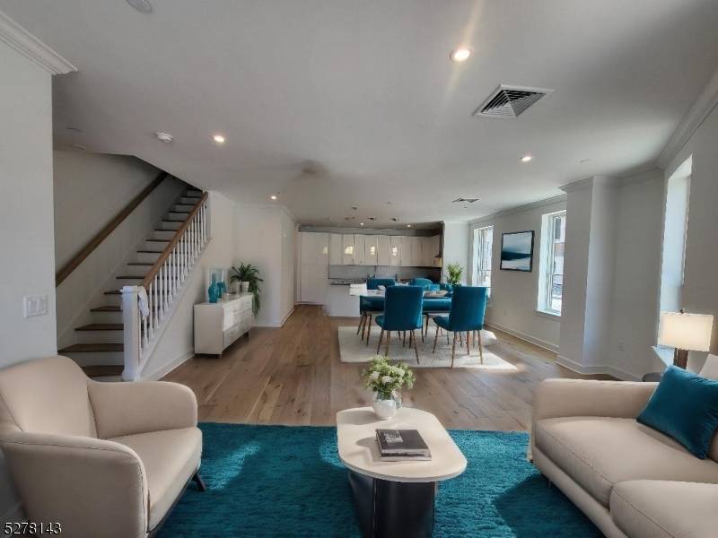 Commuters Dream ! Luxury Townhouse Living across from Bloomfield Train Station with direct service to New York Penn Station which is less than a 30 minute commute.