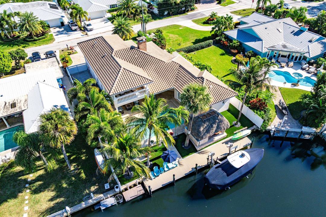 Experience elevated waterfront living in this totally remodeled CBS residence, perfectly positioned in the heart of Jupiter with tranquil canal views opening to the Loxahatchee River.