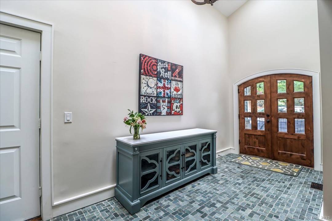 Nestled on over 2 peaceful acres, this beautifully remodeled mountaintop retreat blends natural serenity with architectural charm.