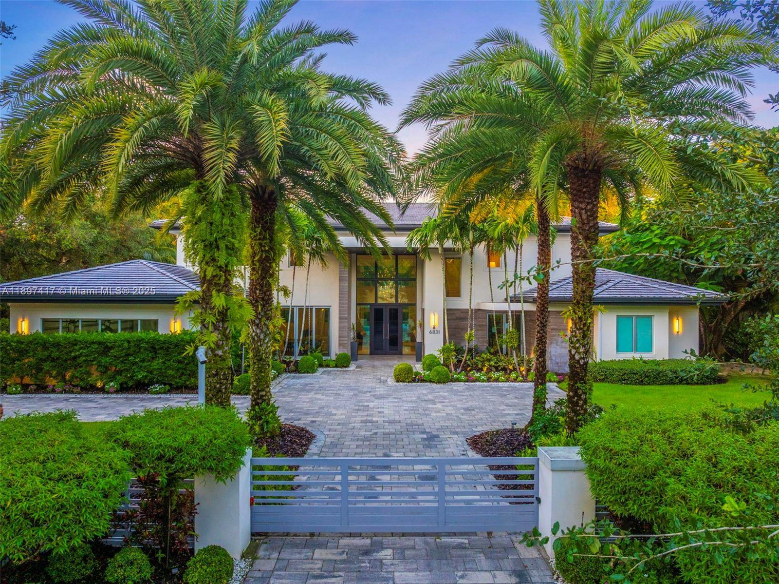 Just a 5 minute drive to Gulliver Prep and close to Miami s top schools, this gated 6 bedroom, 7.