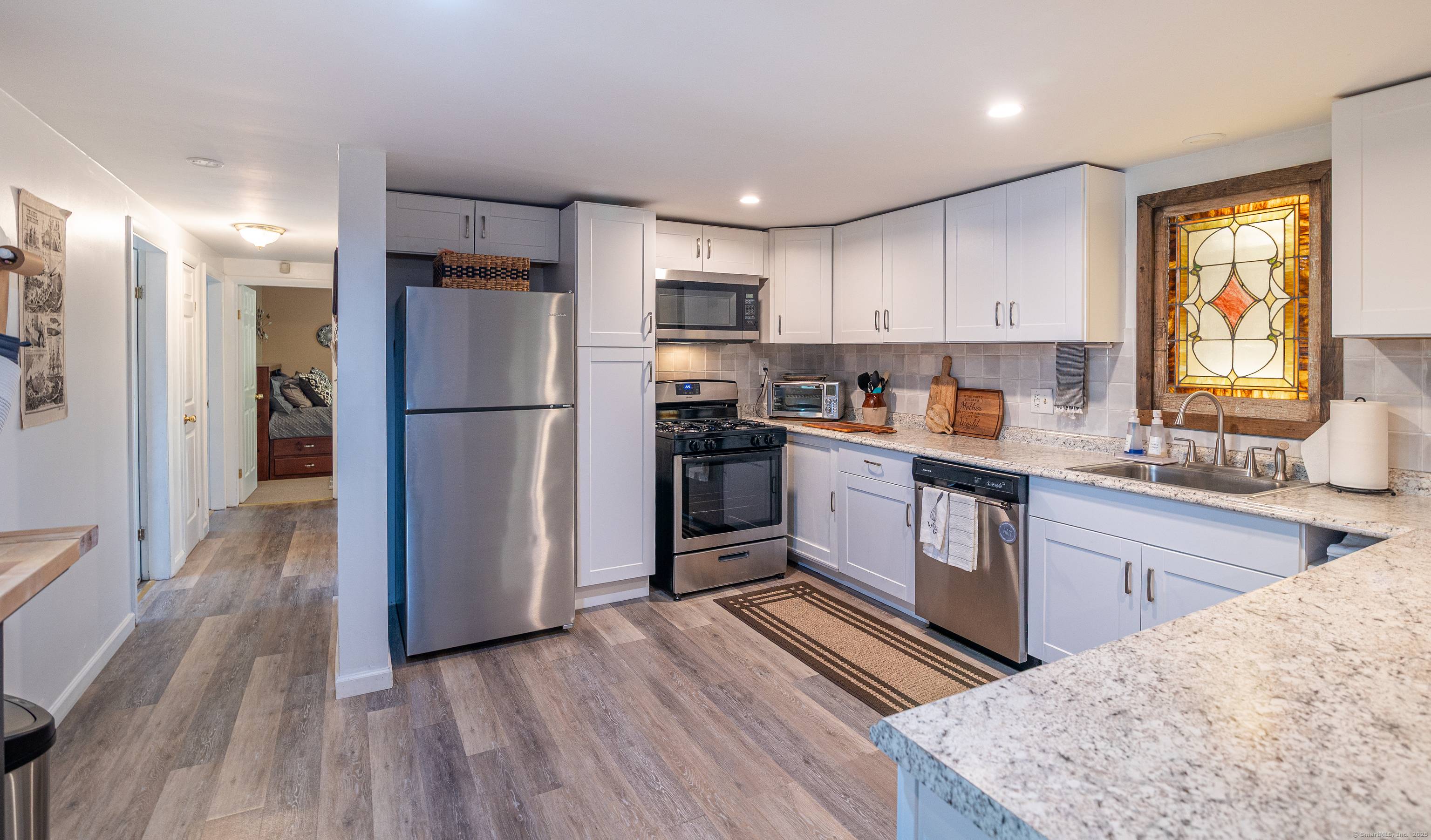 This renovated home with IN LAW POTENTIAL in Putnam has been completely transformed from a former mixed use property into a spacious, fully residential home.