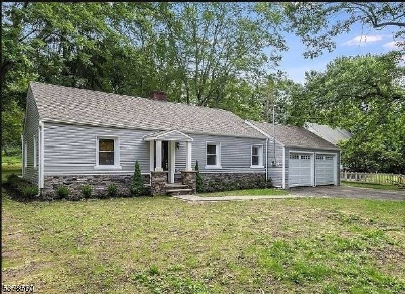 Welcome to this spacious ranch, perfectly situated on a charming tree lined street.