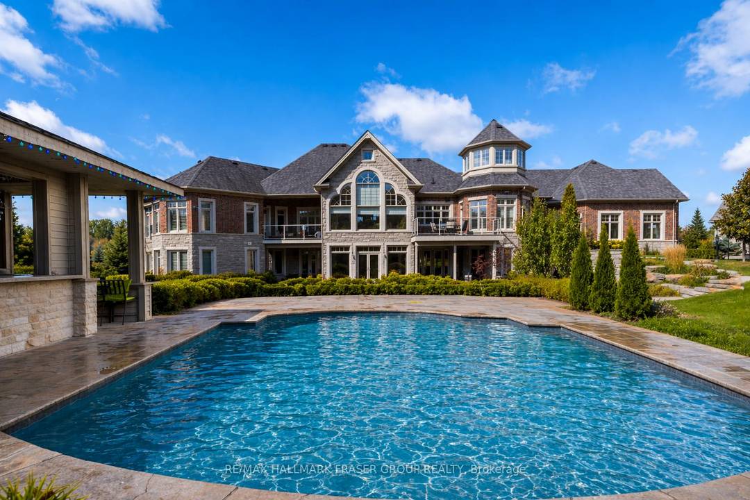 Set within the prestigious Barclay Fieldstone Estates enclave, 3335 Hollywood Crt is a rare custom bungalow on approximately 1.