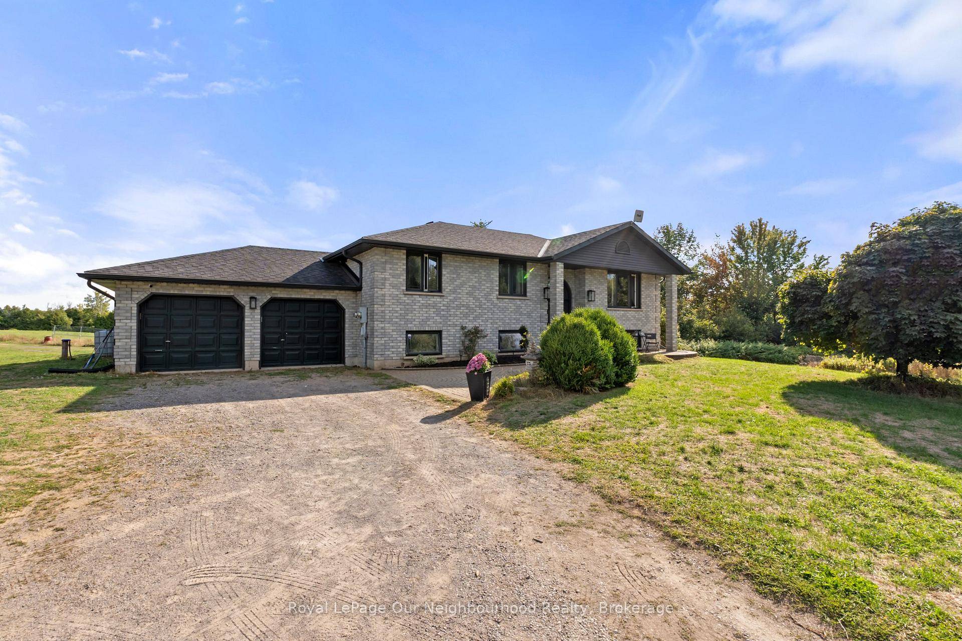 Discover exceptional build quality and professional workmanship in this 4 bedroom, 2 bath raised bungalow set on nearly 3 acres of private countryside.