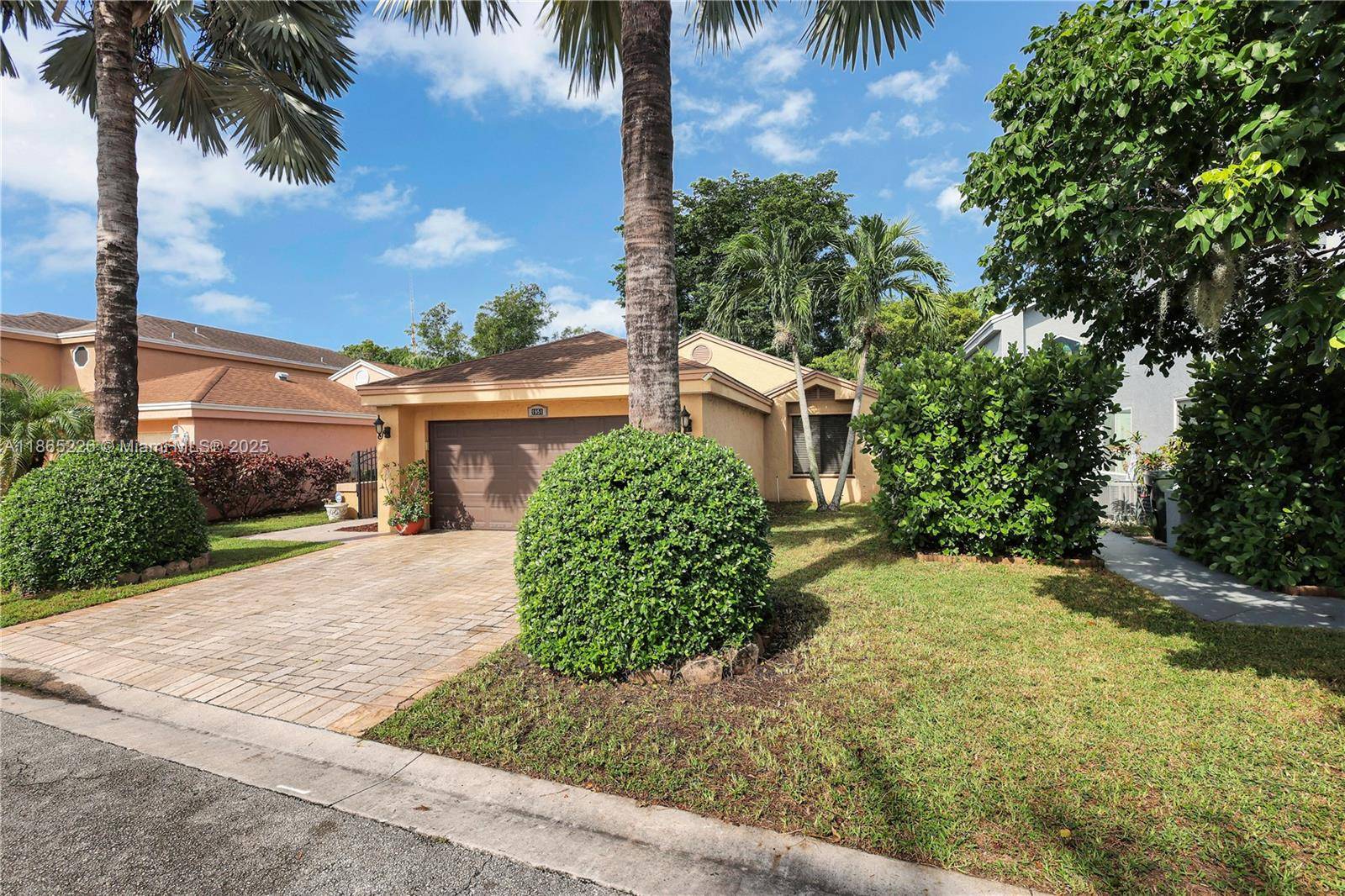 Impeccably updated 3 bedroom, 2 bath home in Coconut Creek featuring a bright open layout with high ceilings, skylight in the dining area, and durable LVP flooring.