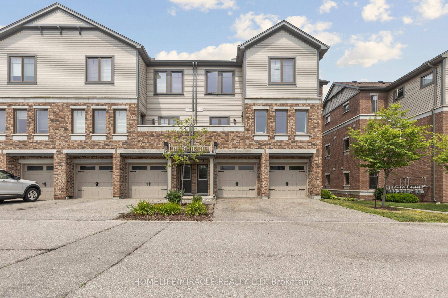 Welcome to 39 Kay Cres 15, a modern corner unit townhouse in Guelph's highly sought after South End !