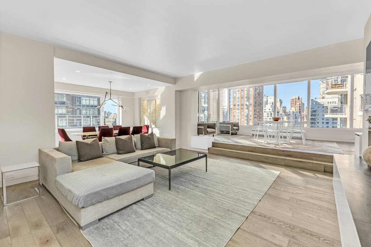 Stunning High Floor Three Bedroom With Terrace The entrance gallery leads to a 26 foot living and dining room with exquisite custom built ins and large East facing window.
