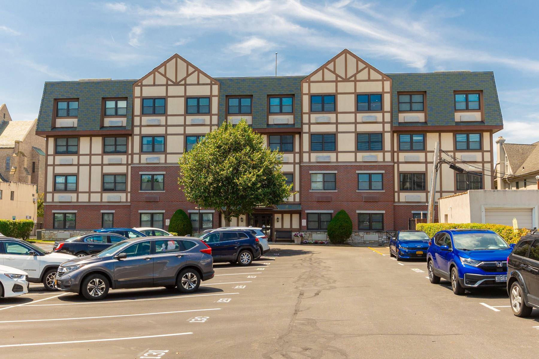 This spacious and inviting fourth floor condominium is located in the Cathedral Condominiums, a desirable 55 community in the heart of Rockville Centre.