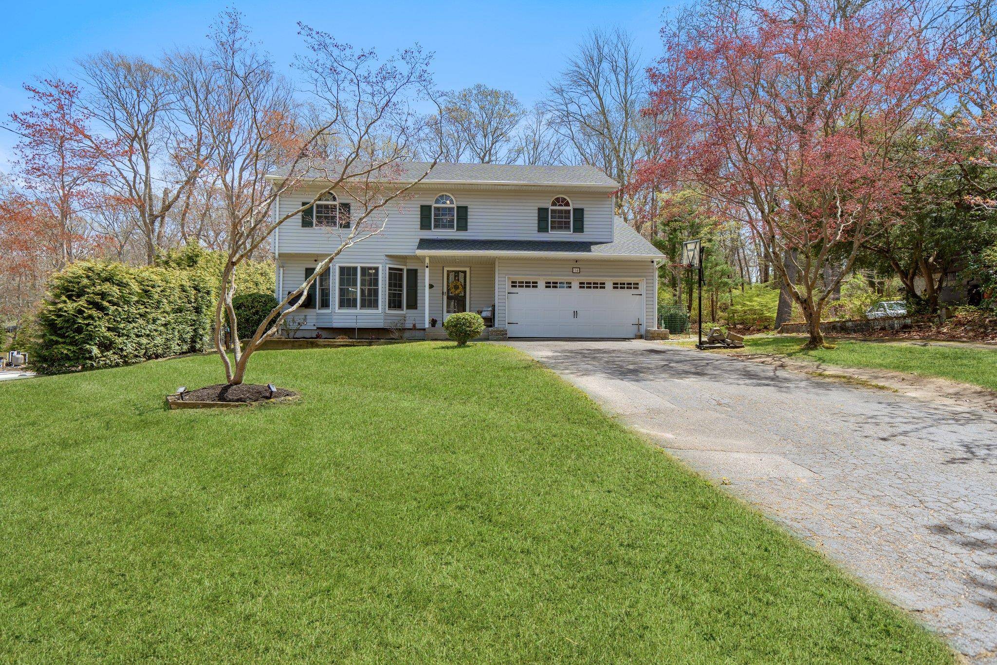 Welcome to 14 Victory Knoll Path, a meticulously maintained and extensively updated colonial in the sought after community of Miller Place !