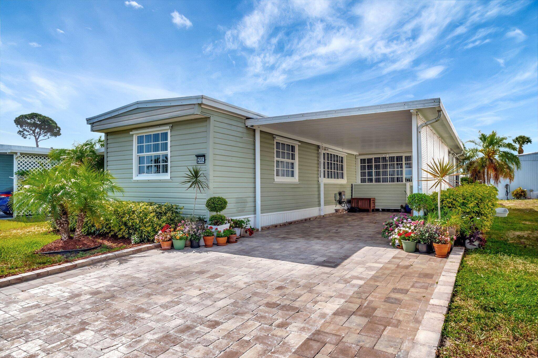 Welcome to carefree living in this beautifully maintained 2 bed 2 bath manufactured home nestled in a desirable gated 55 community.