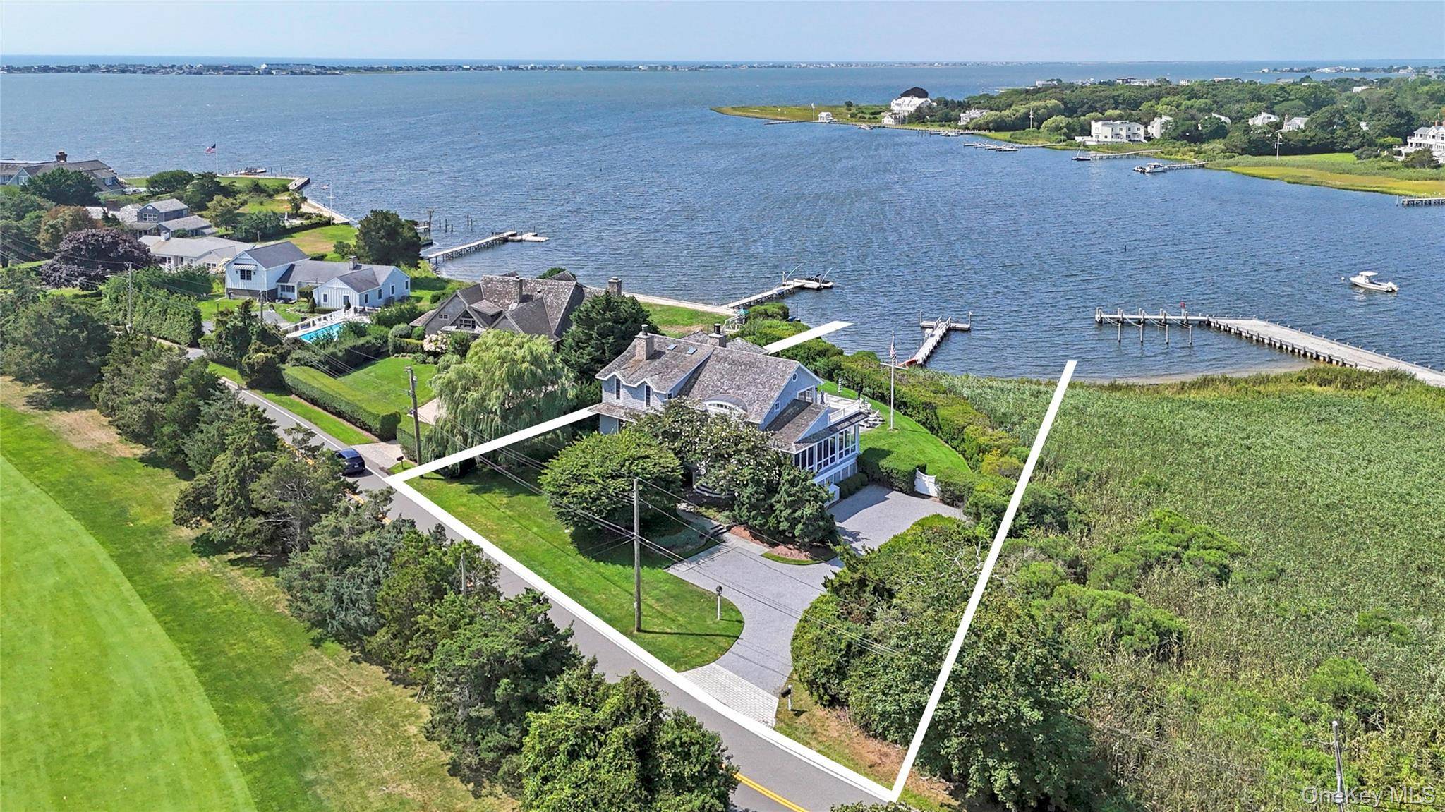 Welcome to elegant waterfront living at 69 Shore Road, Westhampton, NY.