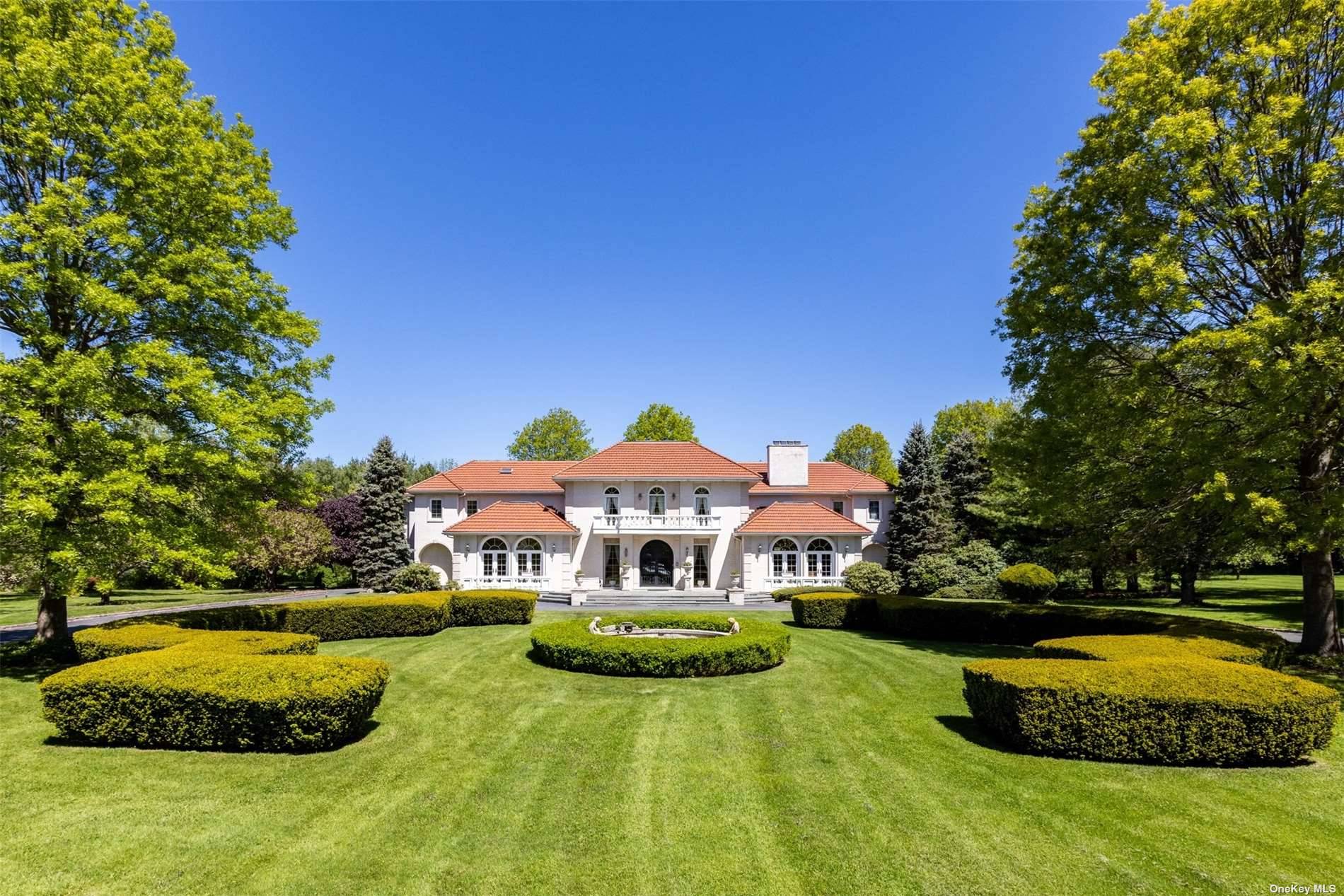 One of a kind private 16 acre estate featuring gated 10, 000SF Mediterranian style solid brick mansion with dramatic 38ft.