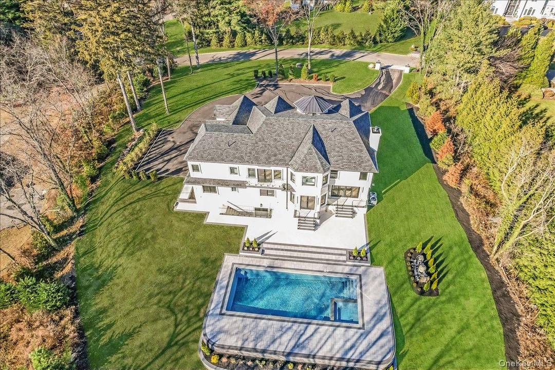 Discover a new level of luxury in this exquisite all brick residence, newly constructed and perfectly situated in one of Old Westbury s most prestigious private cul de sacs.