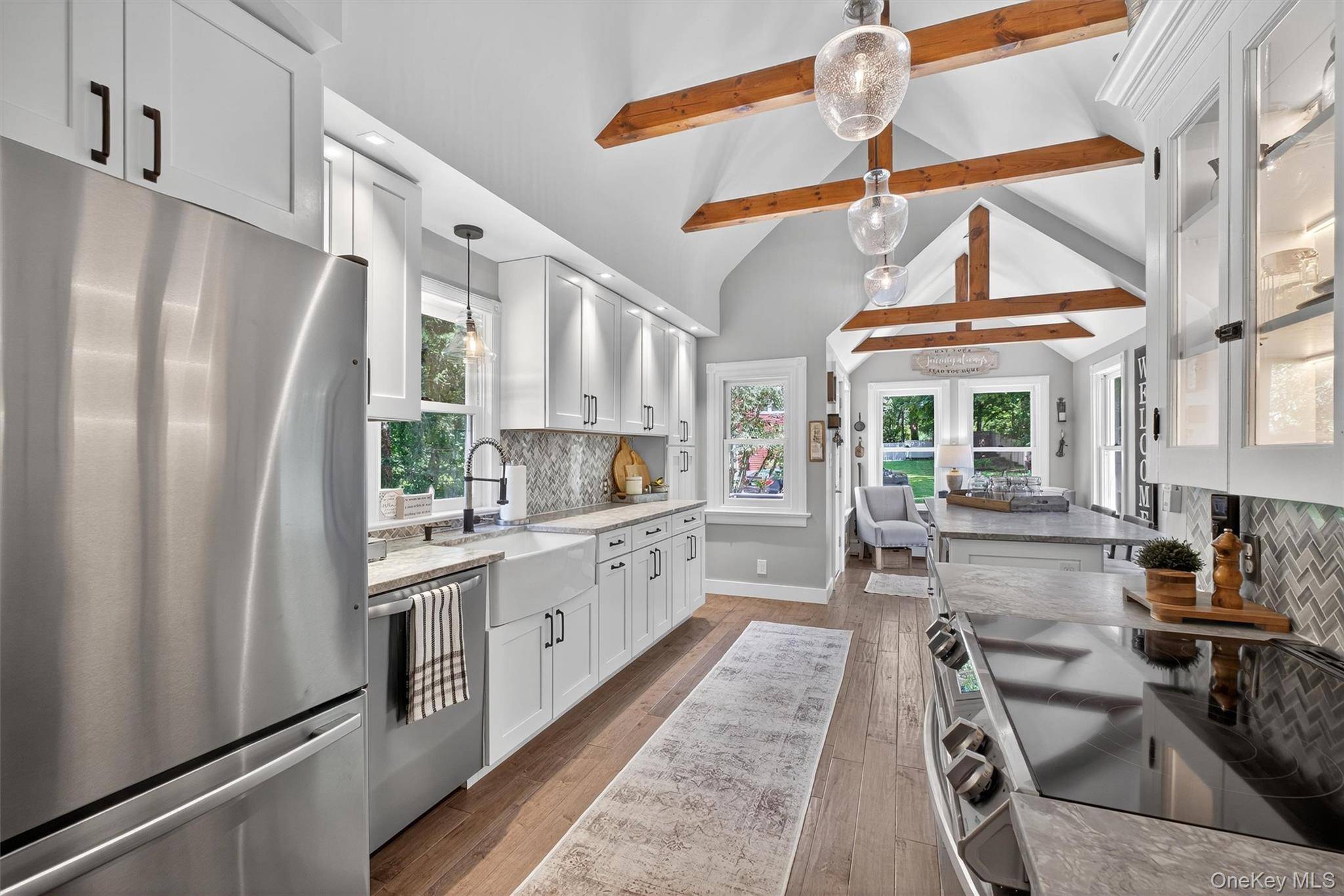 Experience the perfect blend of timeless charm and modern amenities in this stunning, fully refurbished and expanded 1867 farmhouse style Victorian.