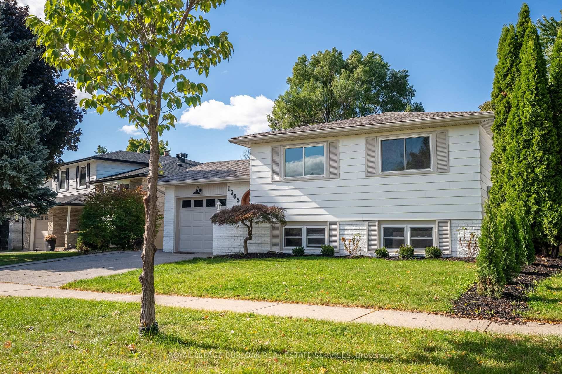 No detail has been overlooked in this absolutely breathtaking 4 bedroom, 3 bath, 2 kitchen raised bungalow, situated in the prestigious Tyandaga community !