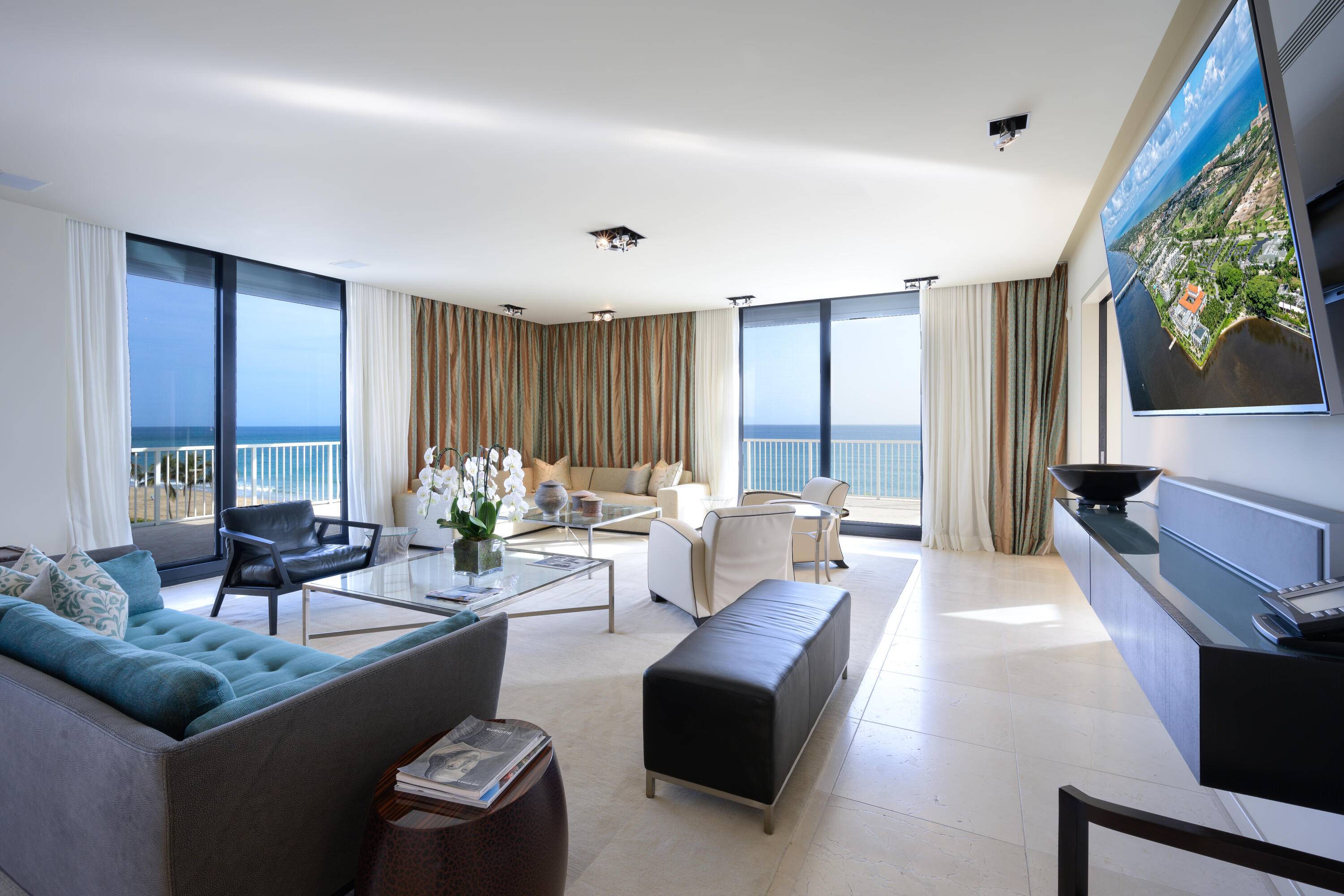 Discover the epitome of seaside luxury in this direct oceanfront corner penthouse, where exceptional living meets modern elegance.