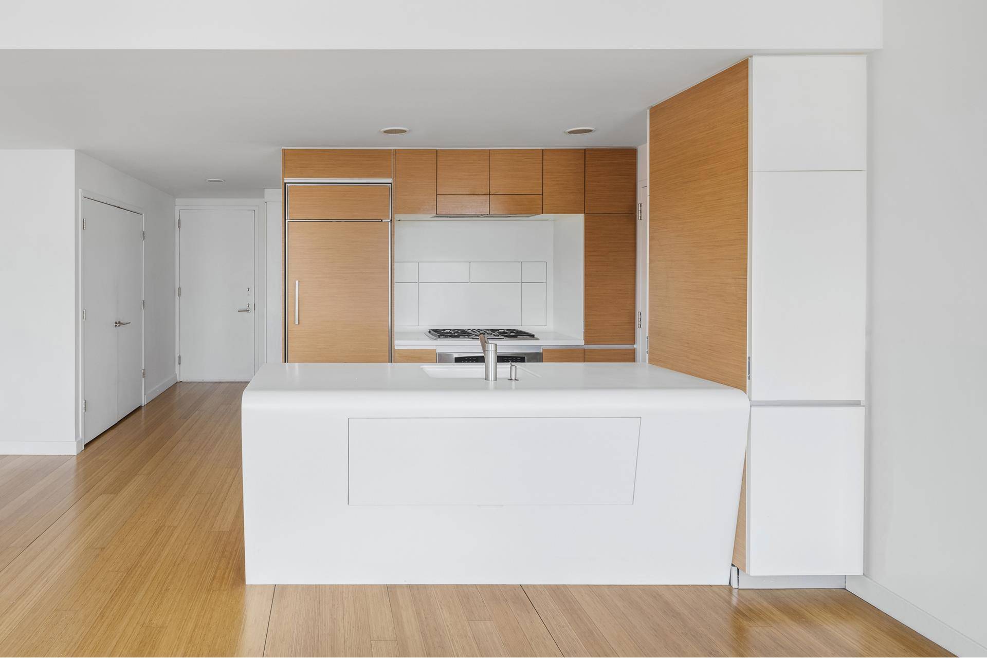 This enormous 1092 sf apartment is among the largest 1BR layouts you will ever see, replete with an additional second bathroom for guests.