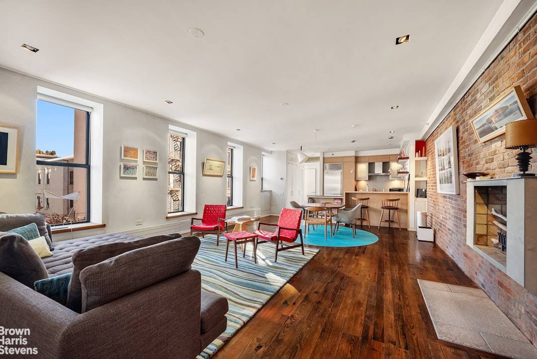 A rare find in the East Village Full floor loft in a boutique, pre war condo building, with key lock elevator, wood burning fireplace, and corner exposure with 17 windows ...