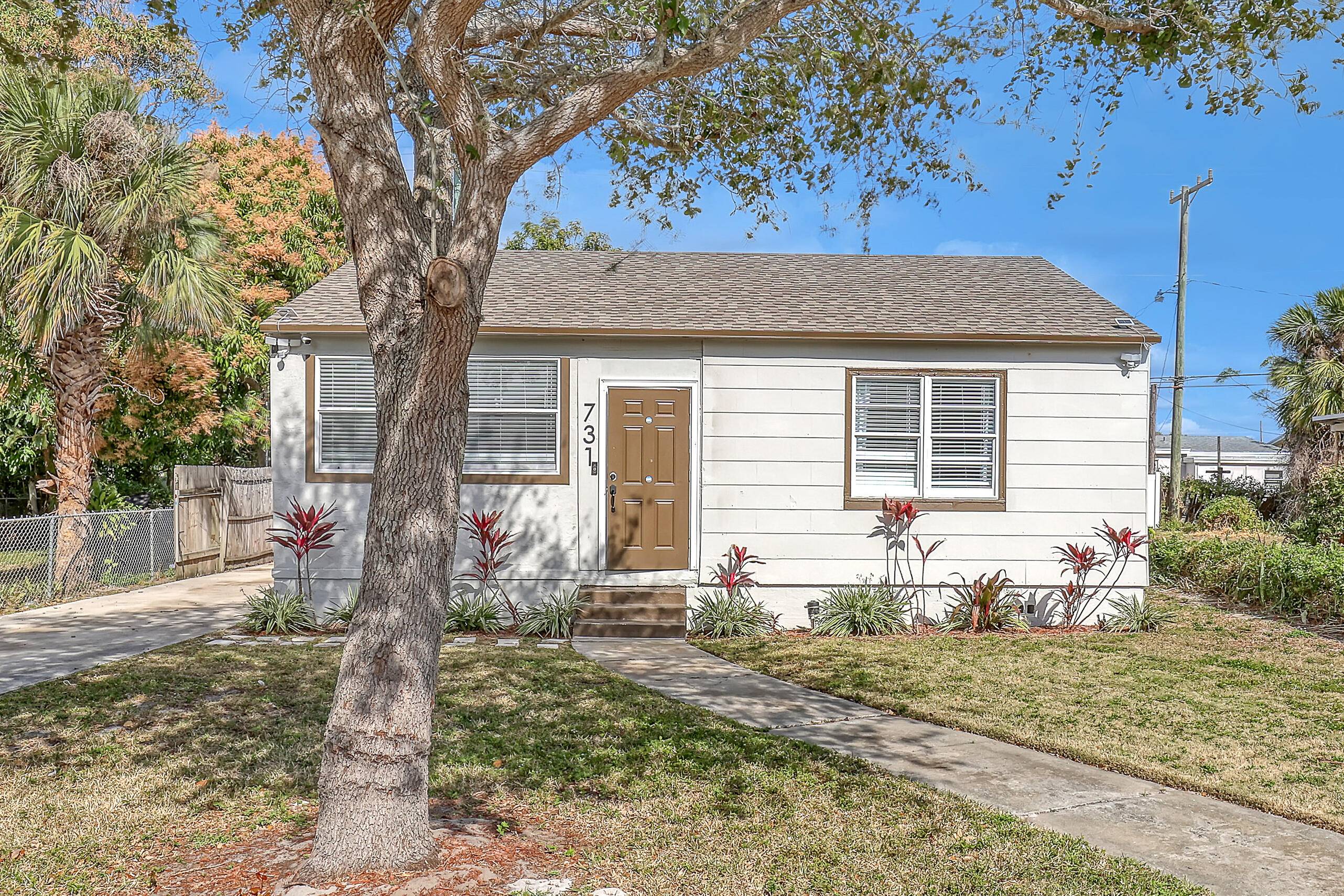 This freshly painted home offers a modern look with a new roof, new A C, new washer and dryer, stunning flooring, and well maintained landscaping.