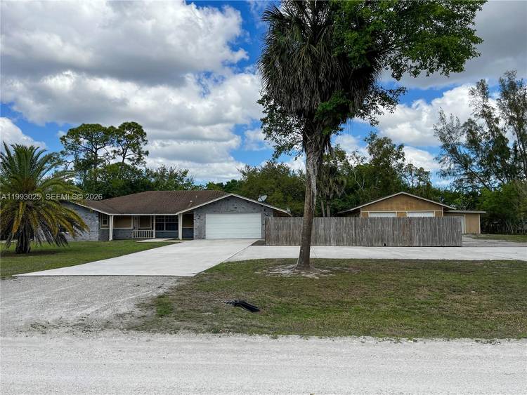 Enjoy this large private lot from your large back patio under roof.