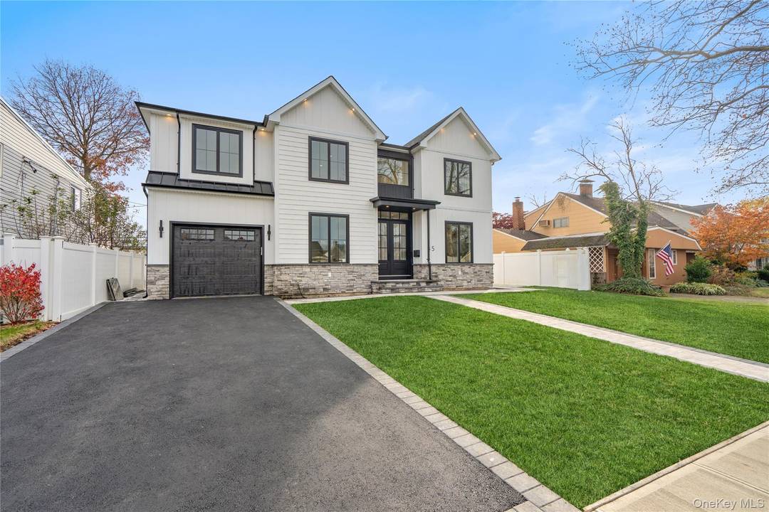 This brand new construction blends modern farmhouse style with timeless elegance, offering 5 bedrooms, 5.