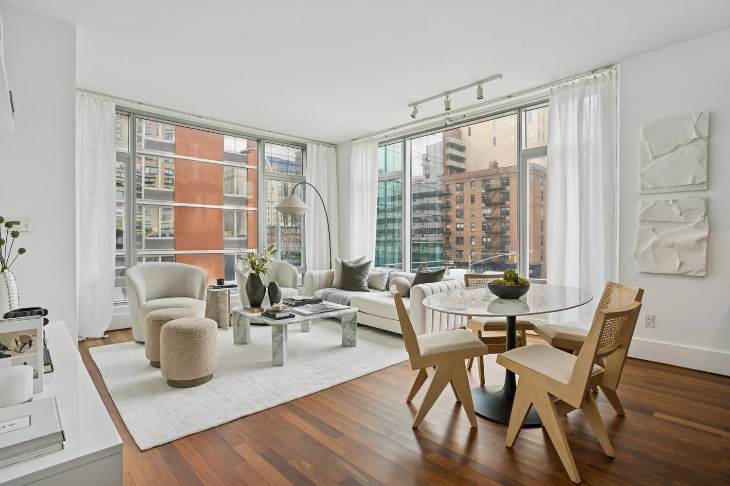 This exceptional two bedroom, two bathroom residence features a welcoming entry foyer that opens to an expansive corner living room framed by a dramatic wall of windows that flood the ...