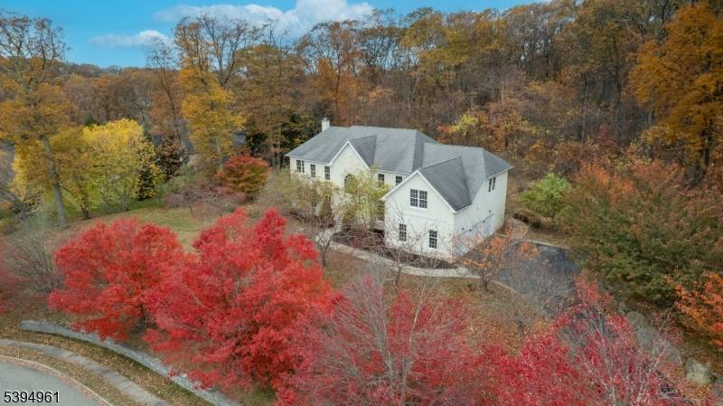 Spectacular 4, 547 sf Colonial set on a beautifully landscaped and private 1 acre lot !