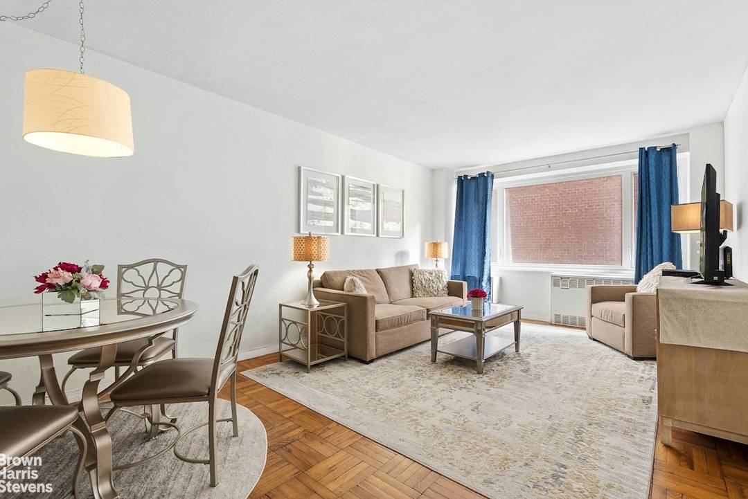 Sutton Manor Condominium, Apartment 4A at 411 East 53rd Street, is a spacious one bedroom, one bath residence suited as either a full time home or an elegant pied à ...